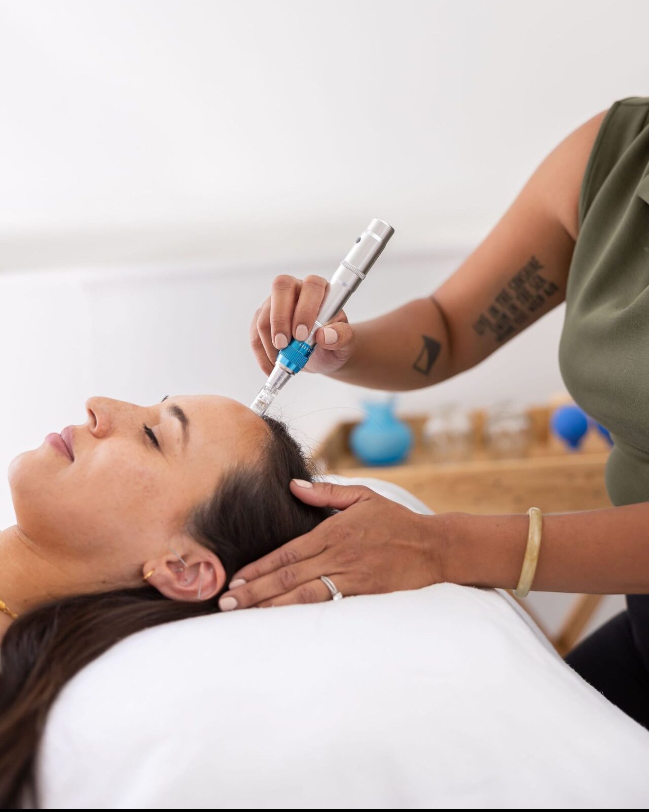 Dr. Monee performing a microneedling facial